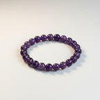 JewelOn amethyst 8mm crystal bead bracelet for men and women, deep violet hue, smooth polished beads, elastic fit.