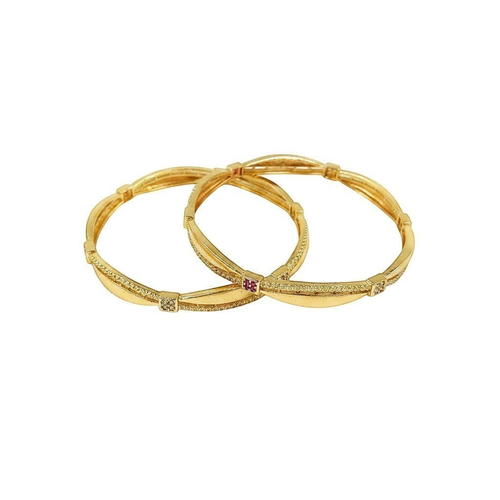 JewelOn gold plated bangles set with intricate detailing and a central ruby accent.
