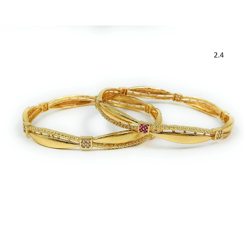 JewelOnGold plated bangles set with intricate detailing and small ruby and diamond accents.