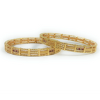 JewelOn Priya gold plated bangles set for women, featuring intricate patterns and small red stones. Traditional ethnic wear.