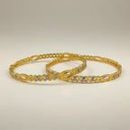 JewelOn Noor gold plated bangles set for women, featuring intricate cut-out details and small clear stones.