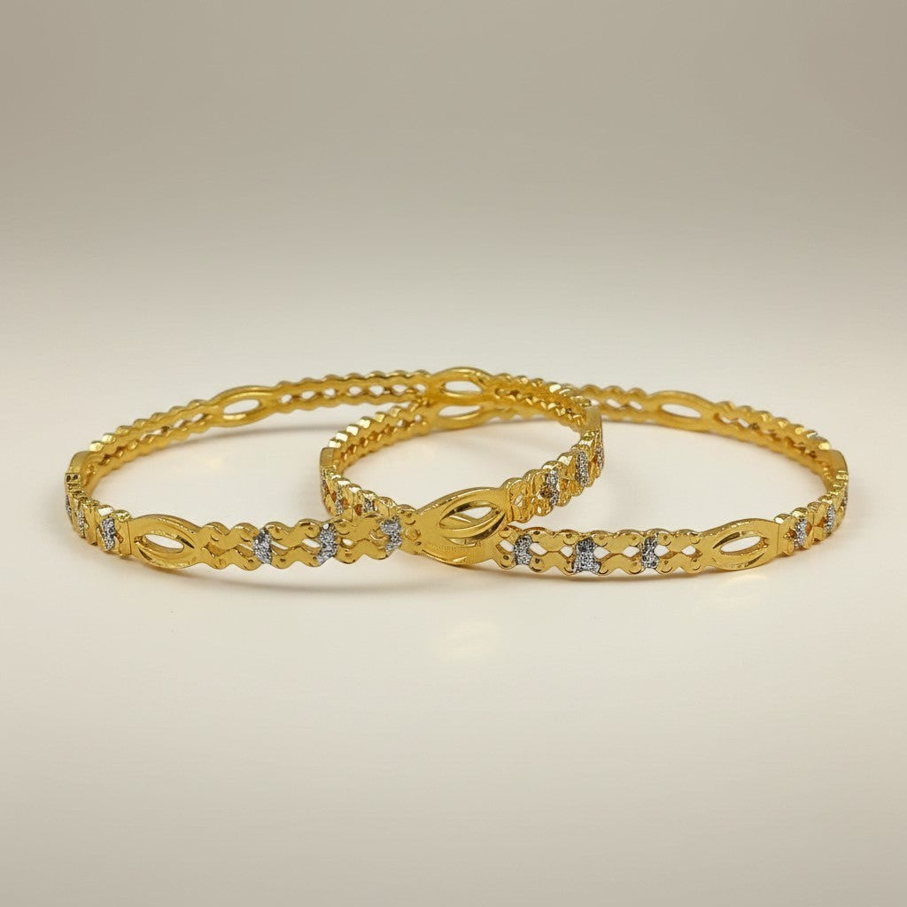 JewelOn Noor gold plated bangles set for women, featuring intricate cut-out details and small clear stones.