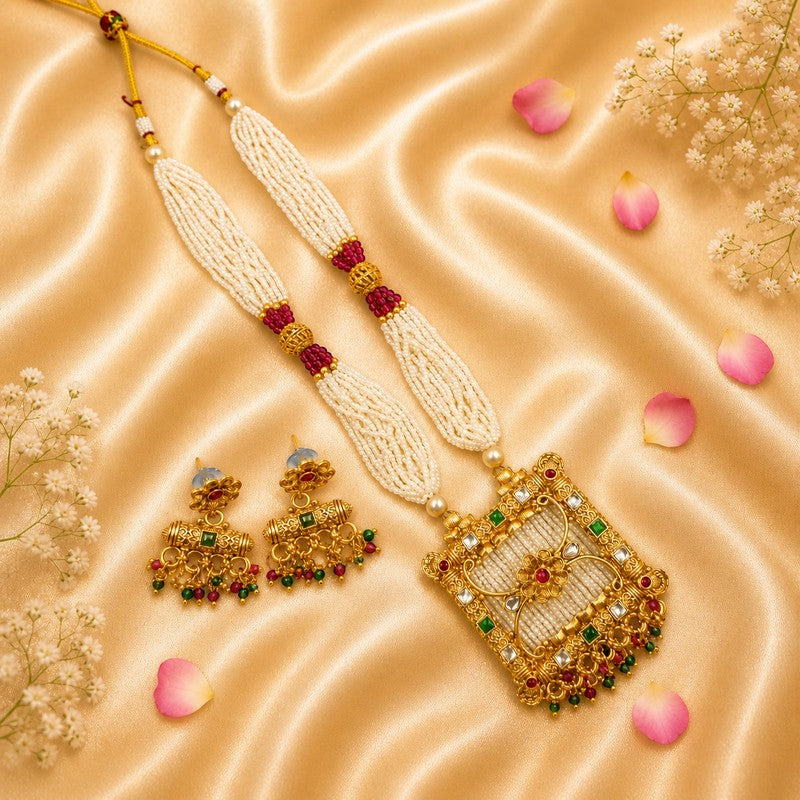 JewelOn Moti Mala long gold-plated pearl necklace set with matching earrings, featuring intricate gold work and red and green stone accents.