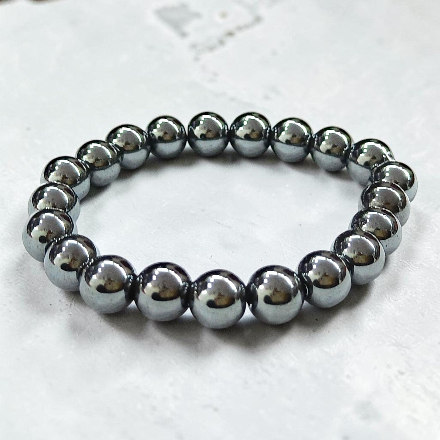 JewelOn Hematite 8mm crystal bead bracelet for men and women, metallic grey-black, grounding and protective.