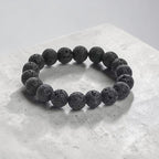 JewelOn black 8mm lava stone beaded bracelet for men and women, elastic band, natural porous texture.