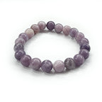 JewelOn 8mm lepidolite crystal bracelet with smooth, polished lilac and lavender beads on an elastic band.