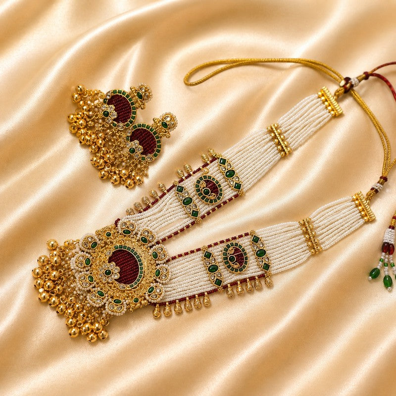JewelOn heritage necklace set with maroon, green, and pearl beads, gold accents, and matching earrings.