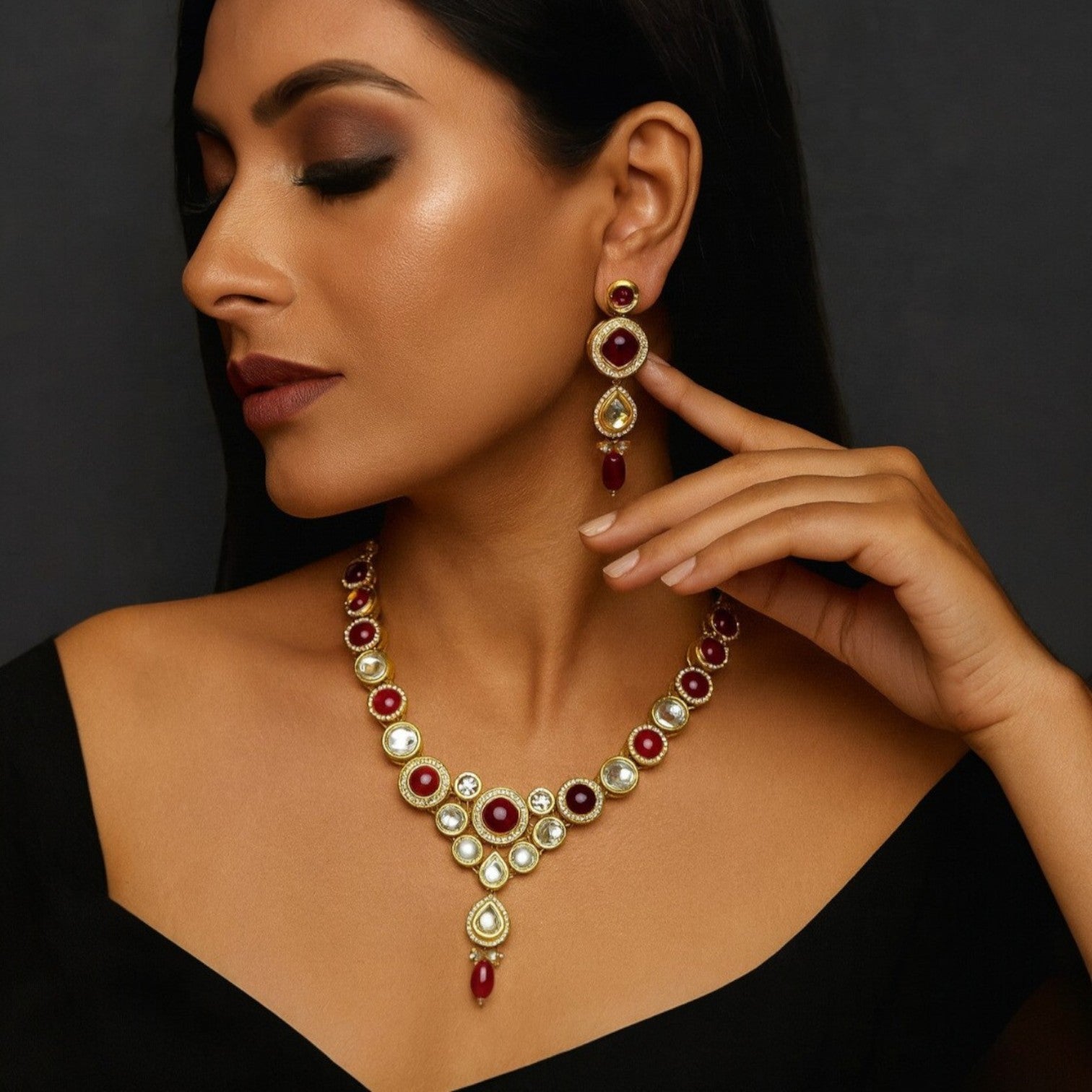 JewelOn maroon kundan choker necklace and earring set with red stones and pearls, worn by a model.