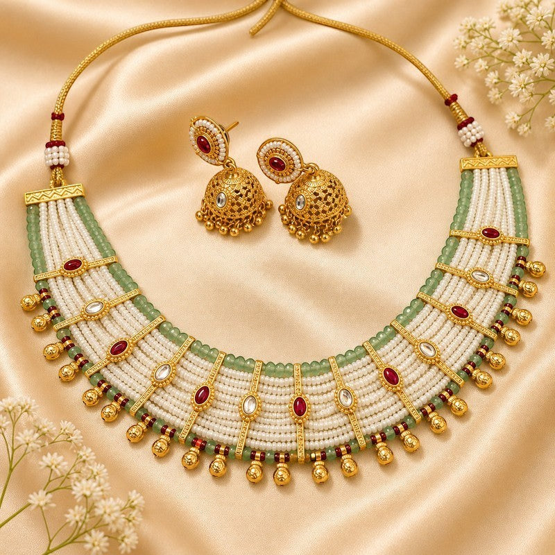 JewelOn Haritima mint green and white pearl heritage choker necklace set with matching jhumka earrings, featuring gold accents and red stone details.
