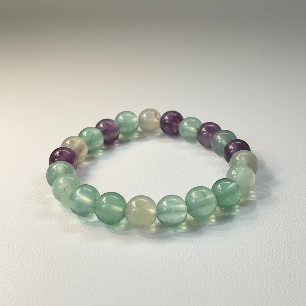JewelOn bracelet with 8mm multi fluorite beads in purple, green, and clear hues on a white background.