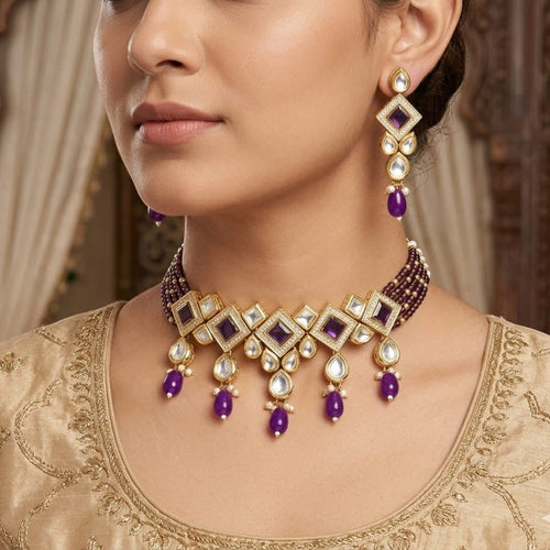 JewelOn purple kundan choker necklace set with matching earrings, featuring intricate gold-tone metalwork and pearl accents.