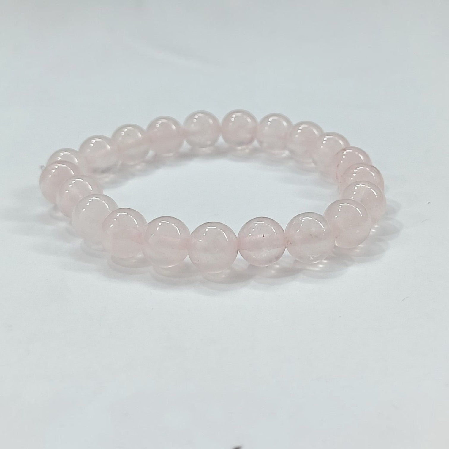 JewelOn Rose Quartz 8mm crystal beaded bracelet for men and women, elastic cord, soft pink.
